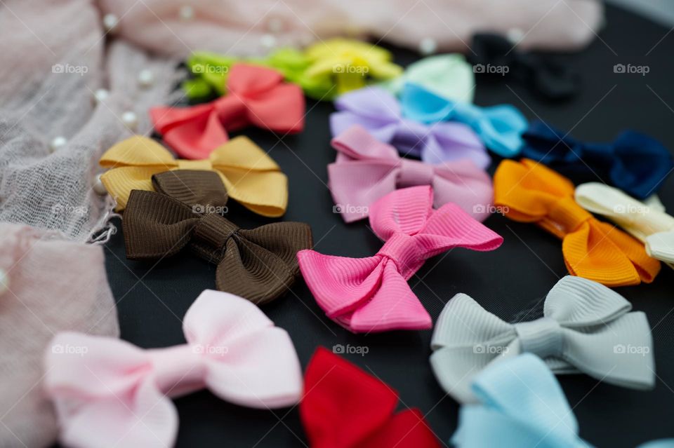 pink bow clips among many colored