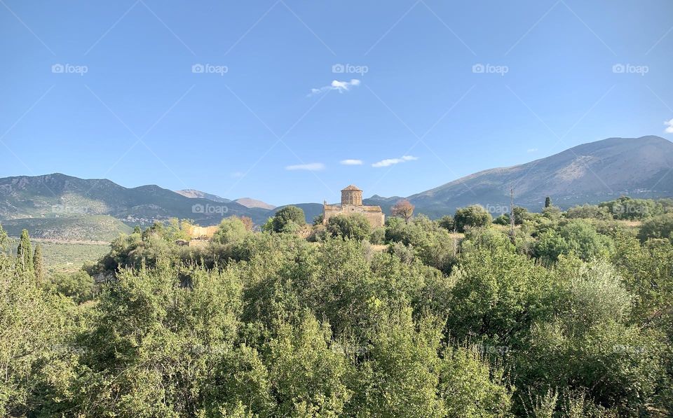 Church on a hilltop in the Mani, Peloponnese, Greece, with the Taygetos mountains in the background 