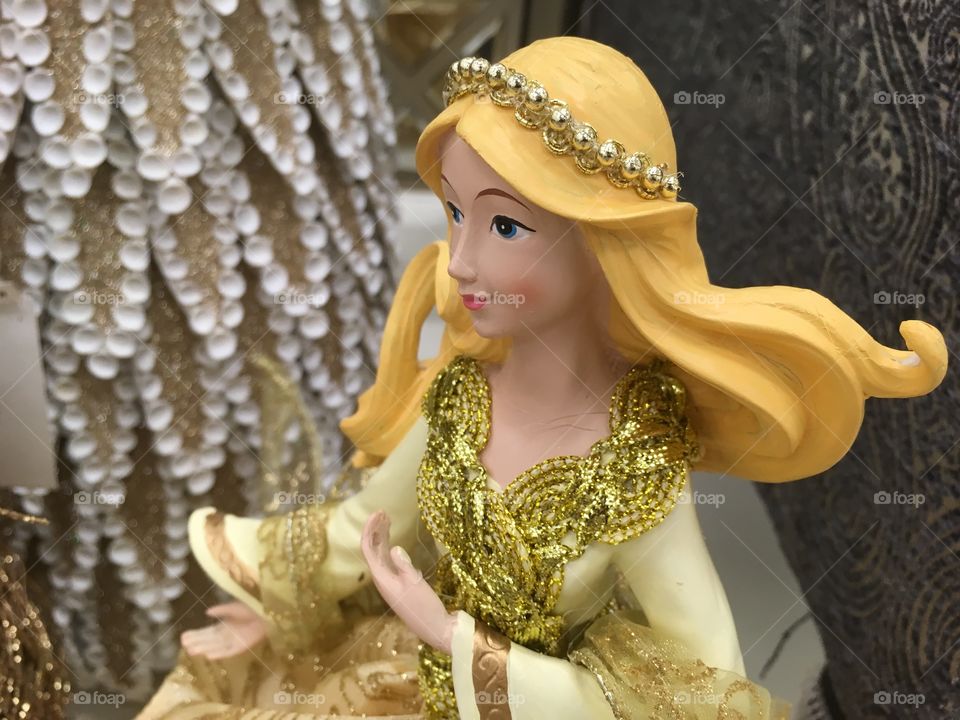 This blonde doll is wearing every shade of yellow. From gold to vivid yellow 