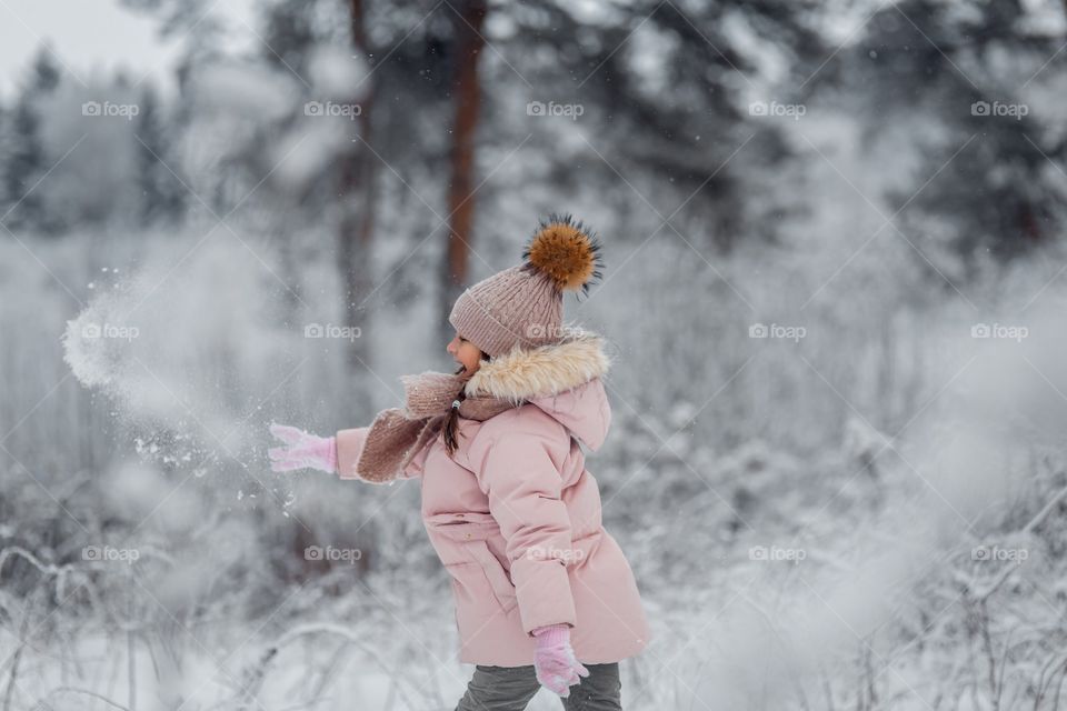 Little girl in a winter park