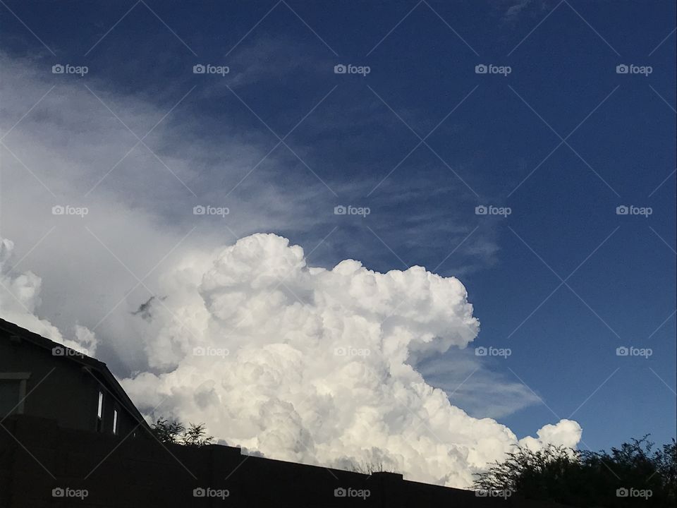 Poofy clouds with blue sky backdrop 