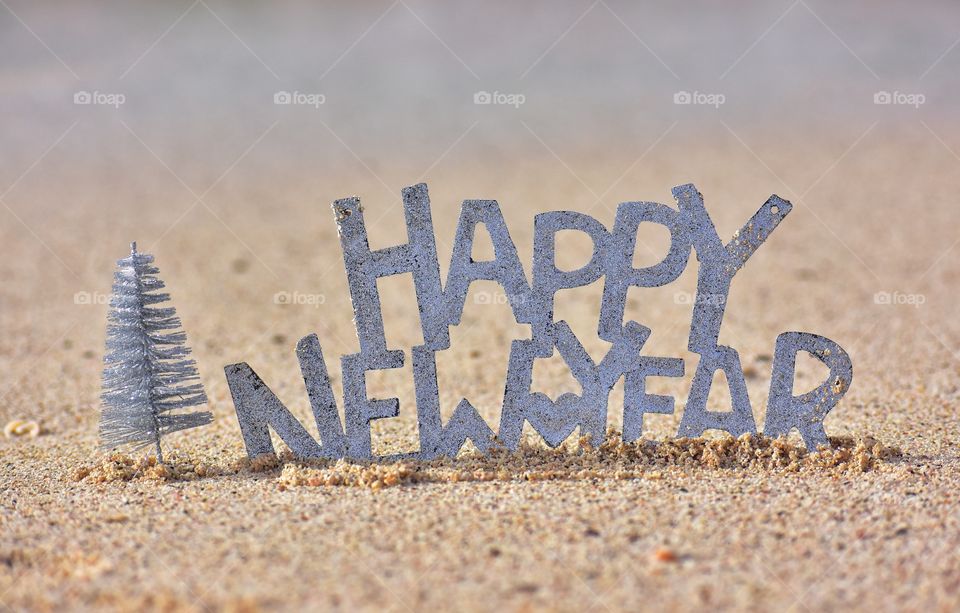 happy New year sign on the beach on fuerteventura canary island in Spain