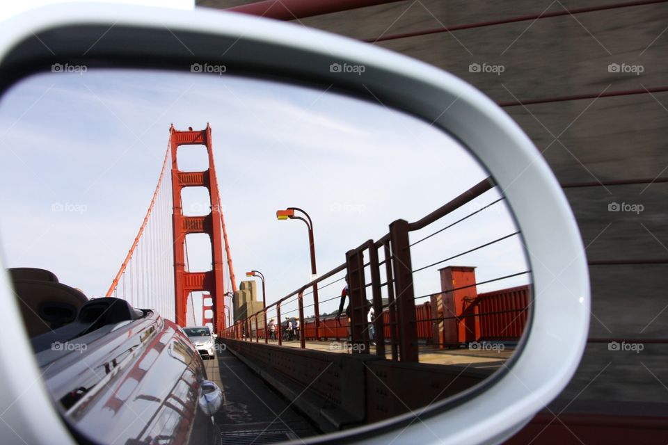 A side mirror view of my commute over the Golden Gate Bridge.