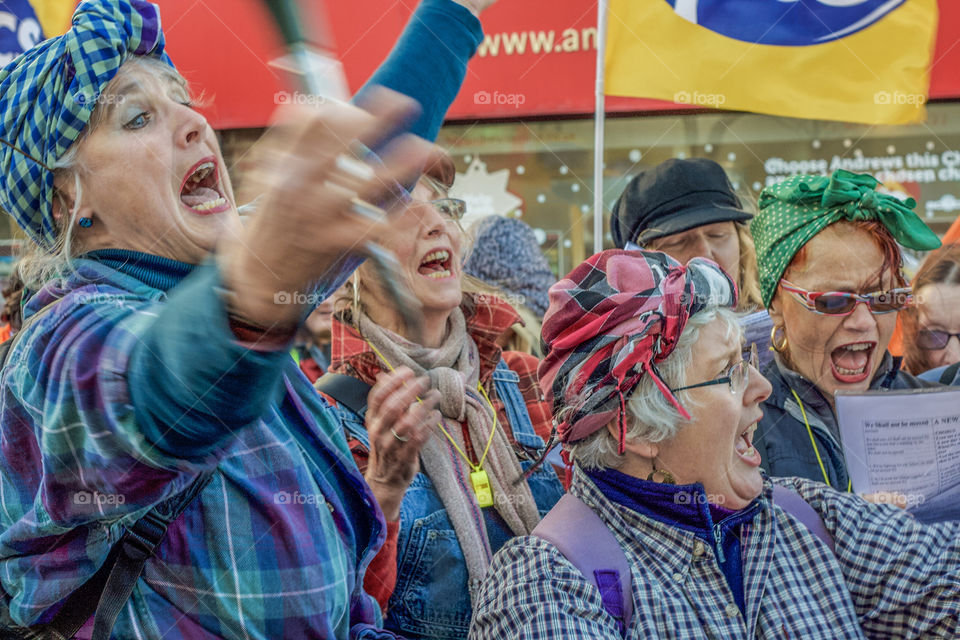A group of women sing in rousing and rebellious chorus at a demonstration against government cuts 😉