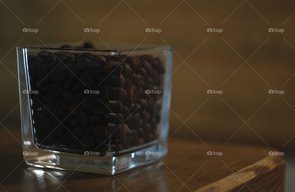 coffee in a glass on a wooden counter in a cafe