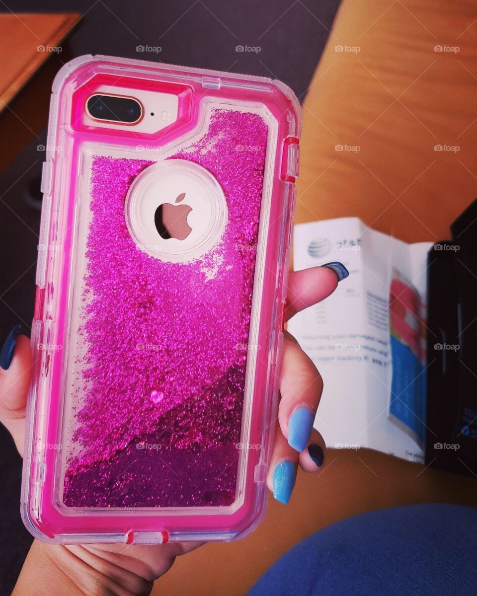Pink glitter case for iPhone 8+. Blue coffin shaped acrylic nails.