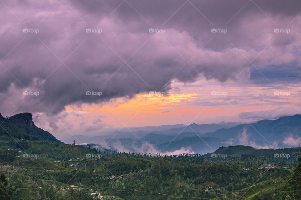 sunrise on cloudy day,through the hills