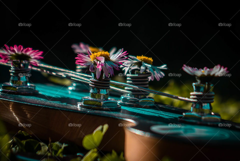 Bass guitar with flowers.