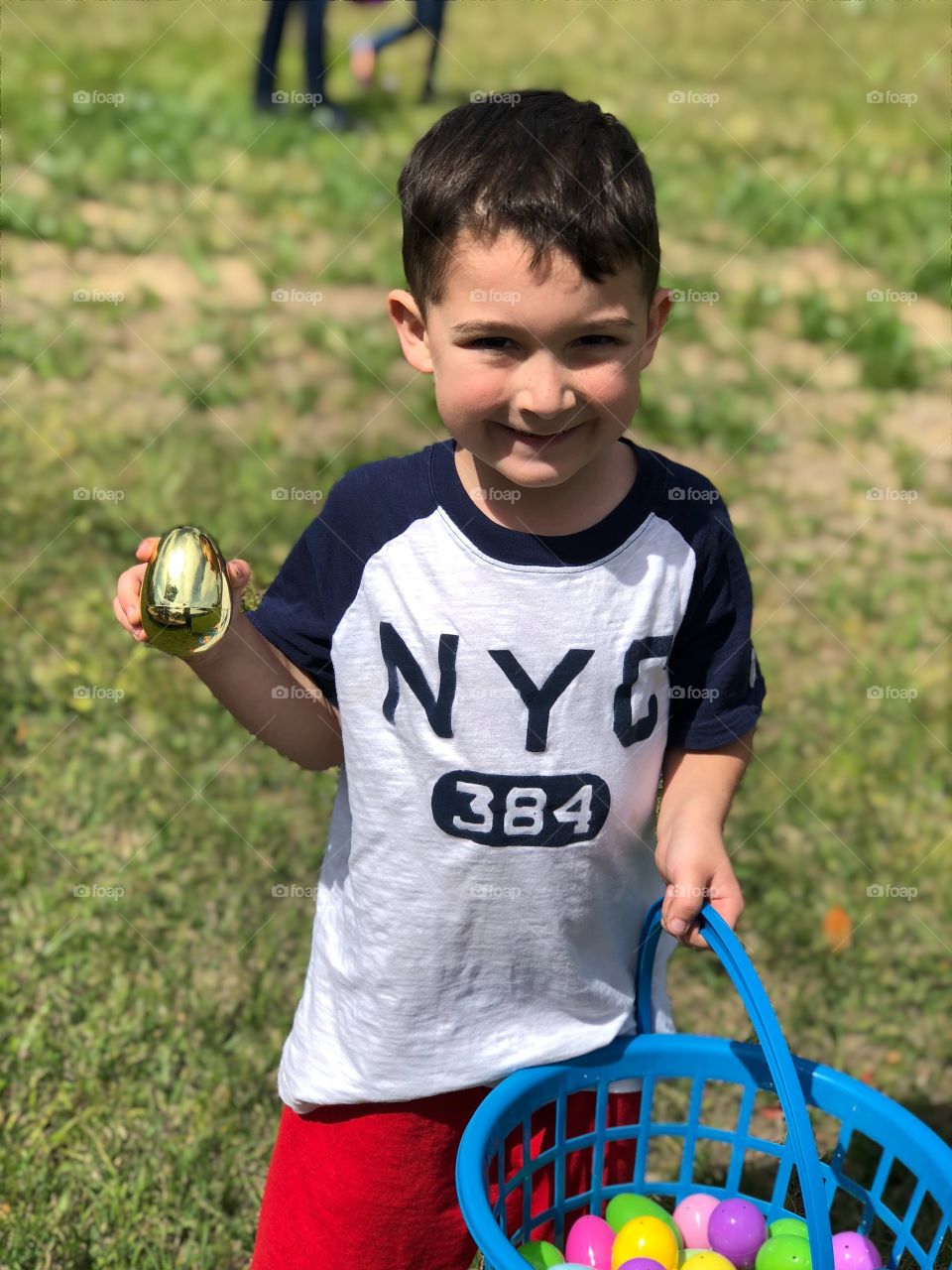 Young boy finding the golden Easter Egg
