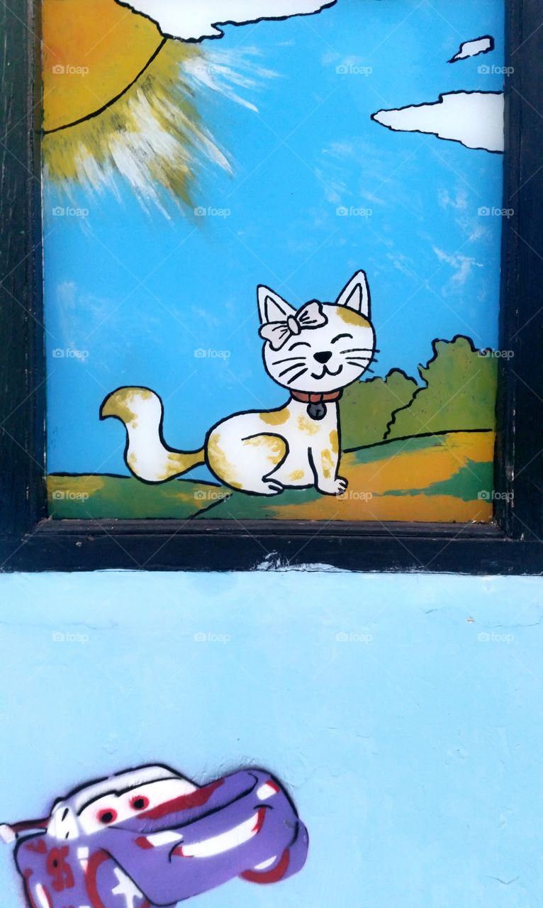 drawing cat and creative at wall