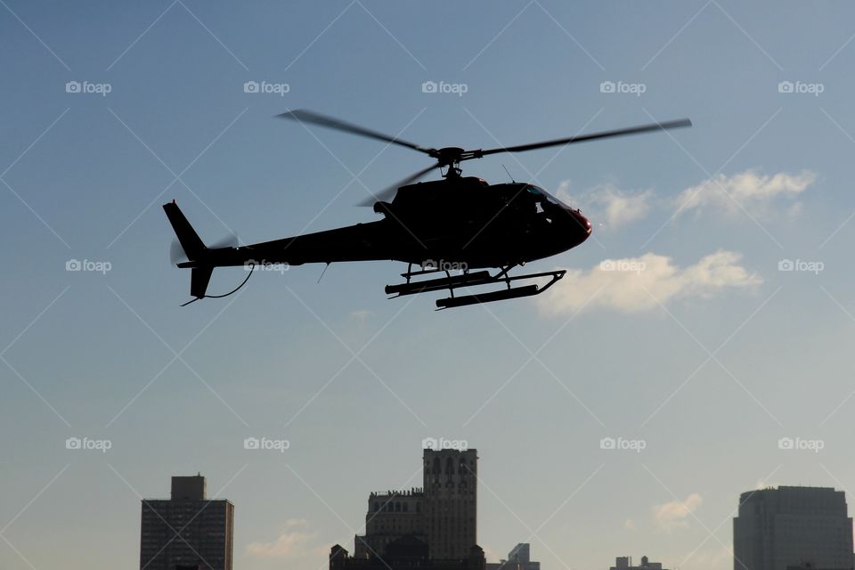 Helicopter flying over new york city