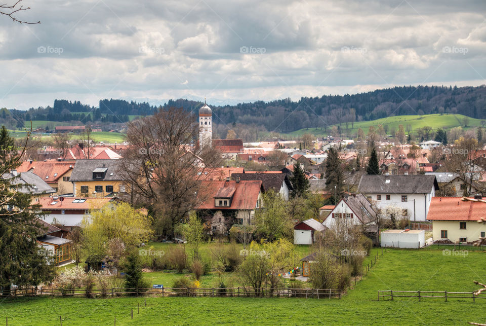 View of a town against cloudy sky