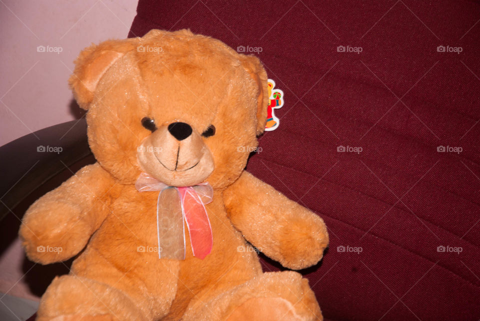 teddy bear sitting in chair