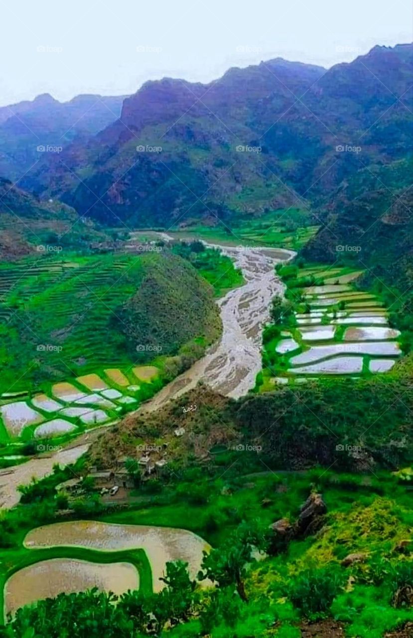 Glory be to God, the magnificent and picturesque view and the natural green trees are a view that is nothing more wonderful than it