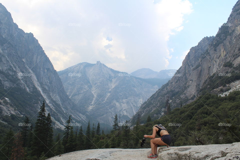 Girl resting in mountain canyon, hiking in national park 
