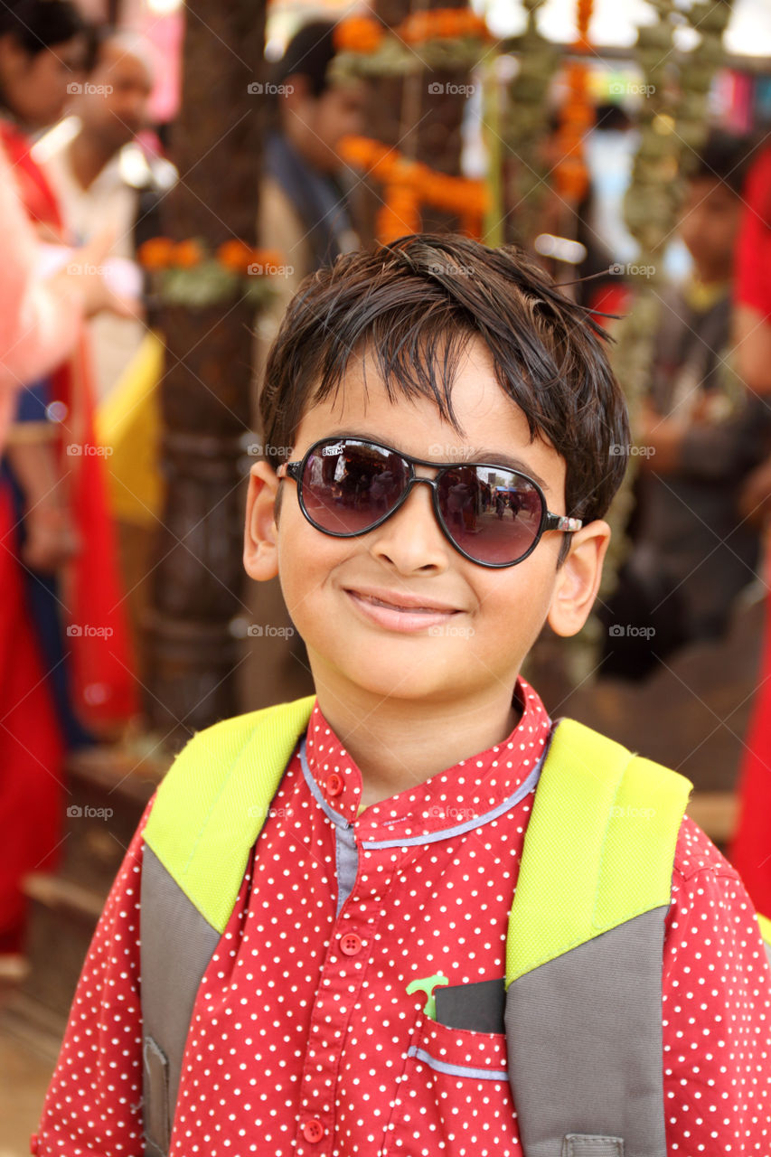 Cute smiling kid outdoors with sunglasses