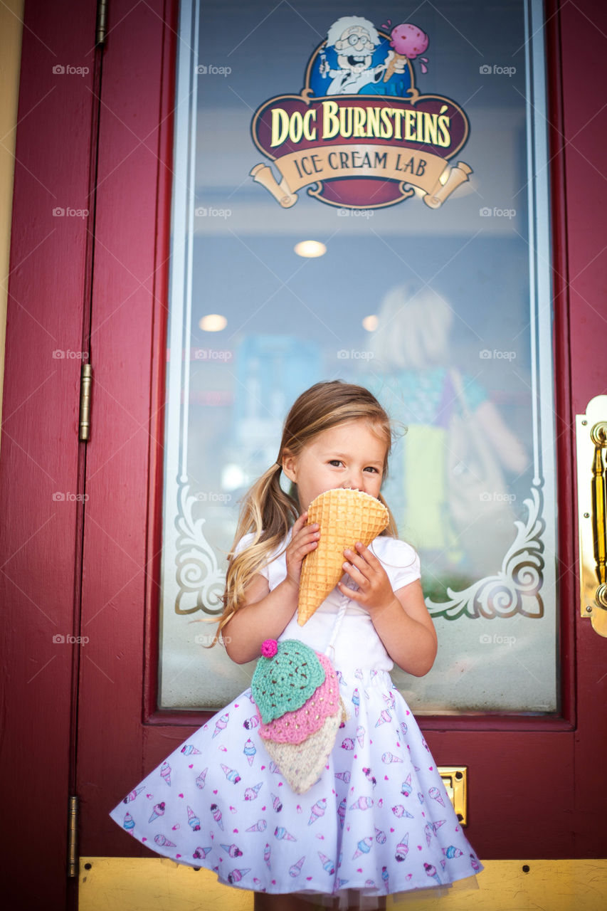 Ice cream summer. Having a big ice cream cone in the summer us pure bliss