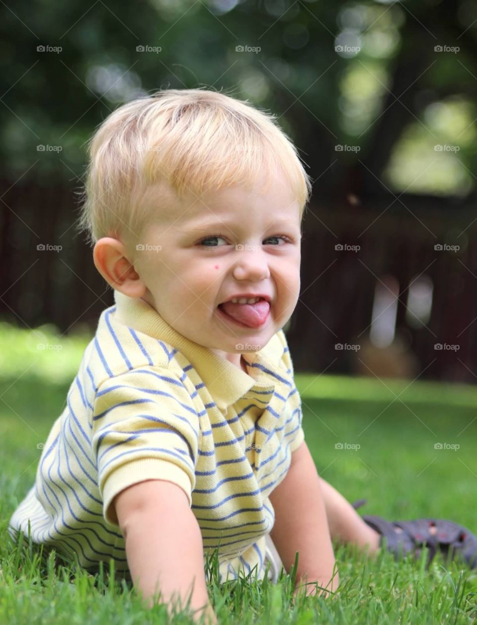 Cute boy playing in grass