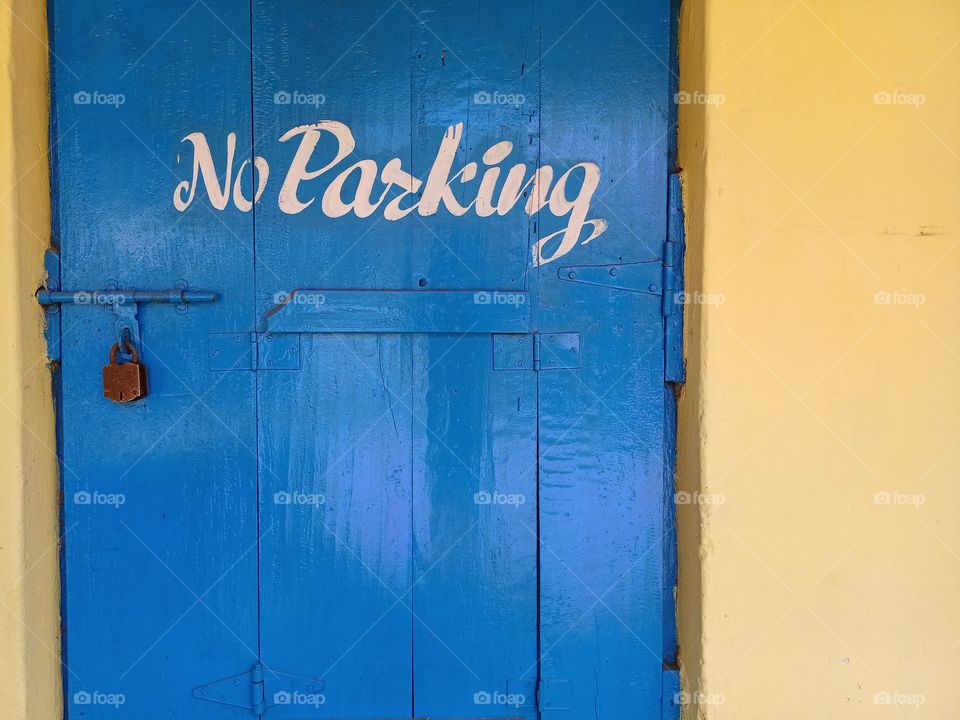 No Parking bord is front of the door