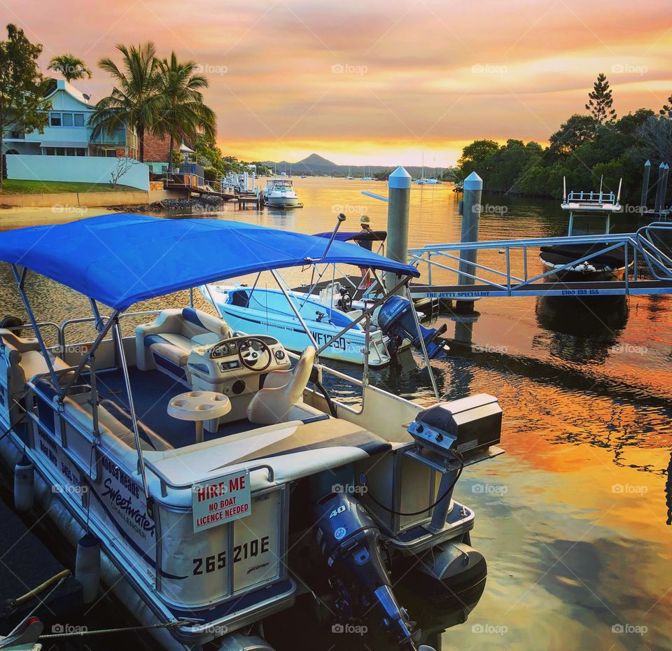 Boat on the water at sunset 