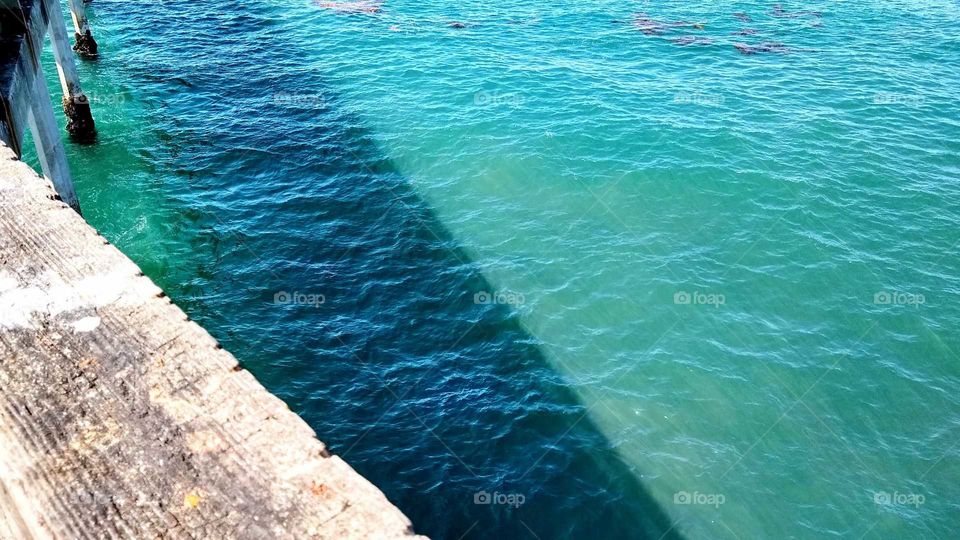 Shadow cast on the water by the Ocean Beach pier (San Diego, CA)