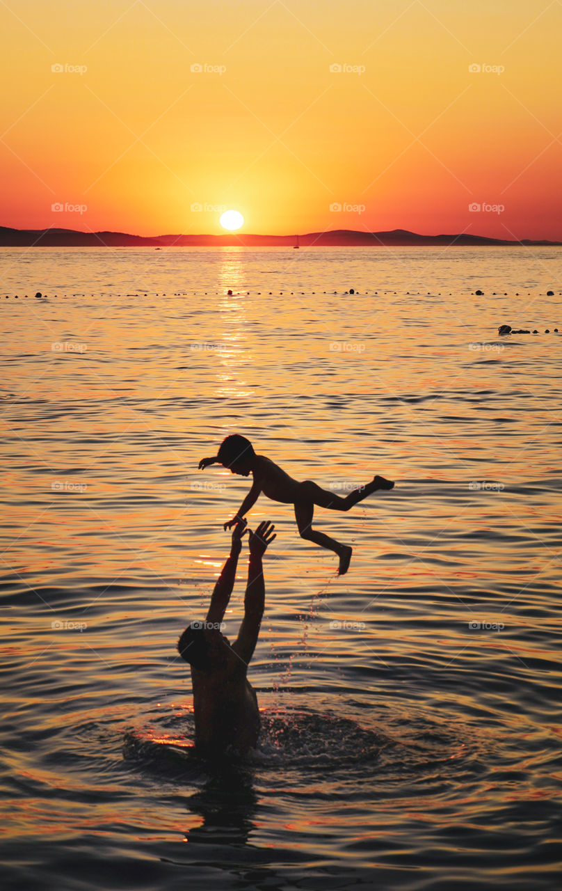 This was such a perfect family moment, the kid was having so much fun and laughing so hard that his dad just kept on lifting him up
