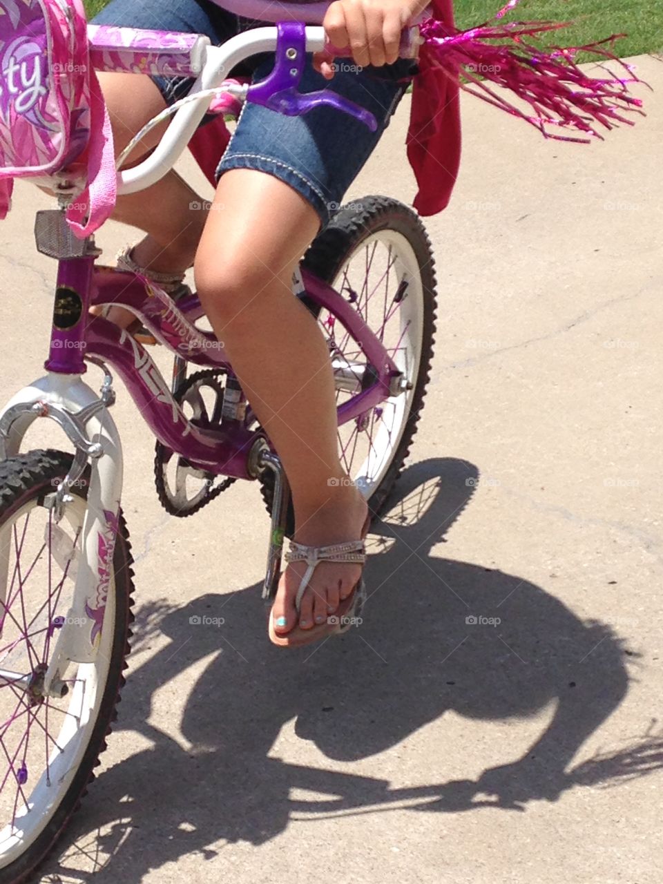 Ride like the wind. Girl riding bicycle