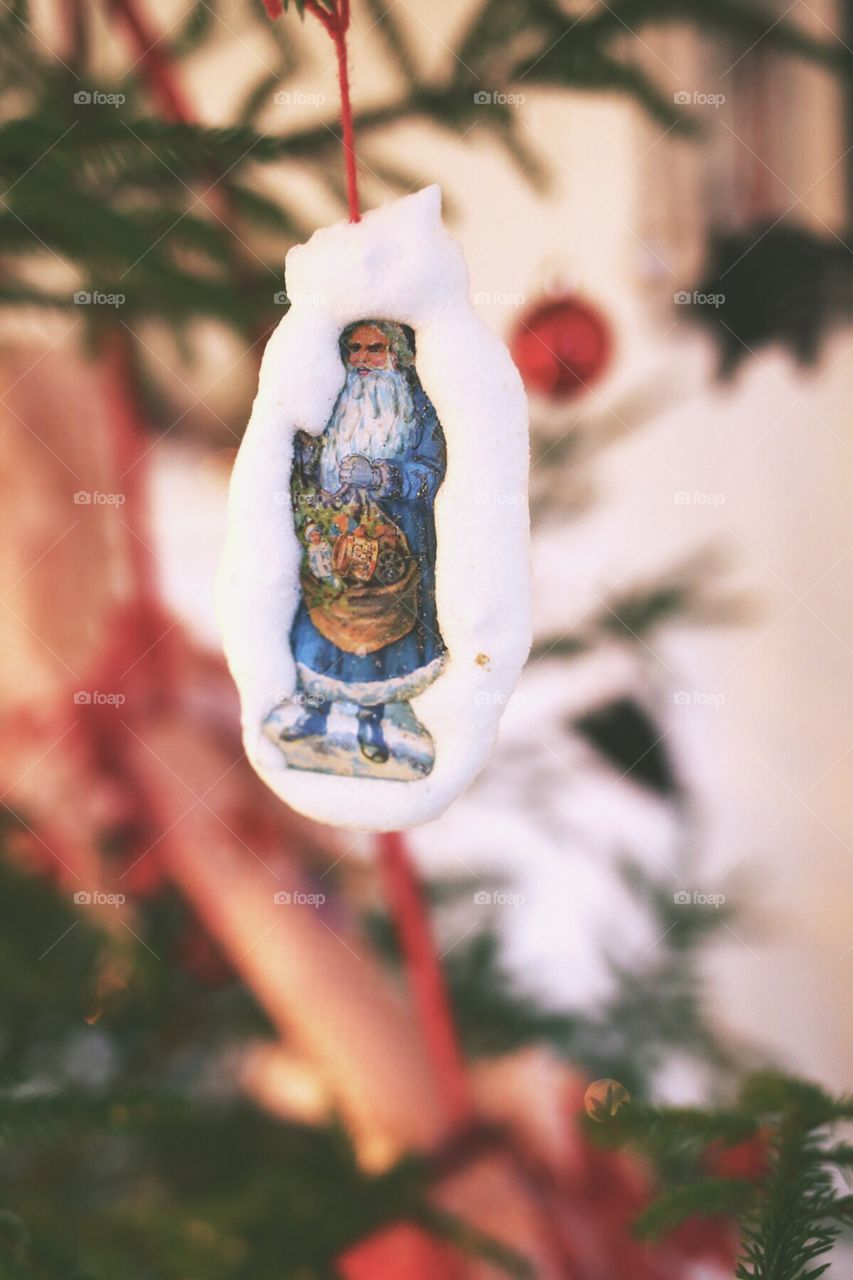 Santa as a Christmas decoration in the Christmas tree