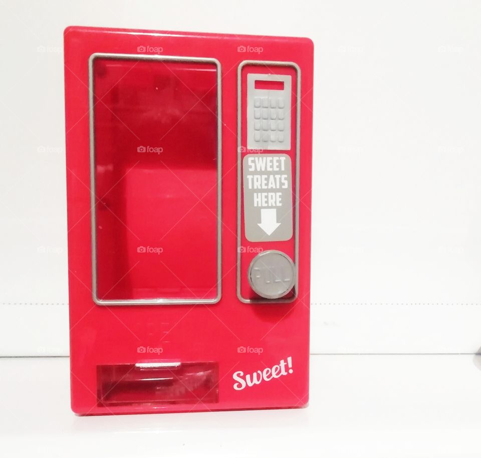 Sweet dispenser.  candy, red, dispenser, sweet, gum, colorful, machine, background, gumball, bubble, blue, white, vending, retro, coin, ball, dispense, food, vintage, isolated, chewing, penny, chew, treat, object, buy, color, glass, colors, slot,