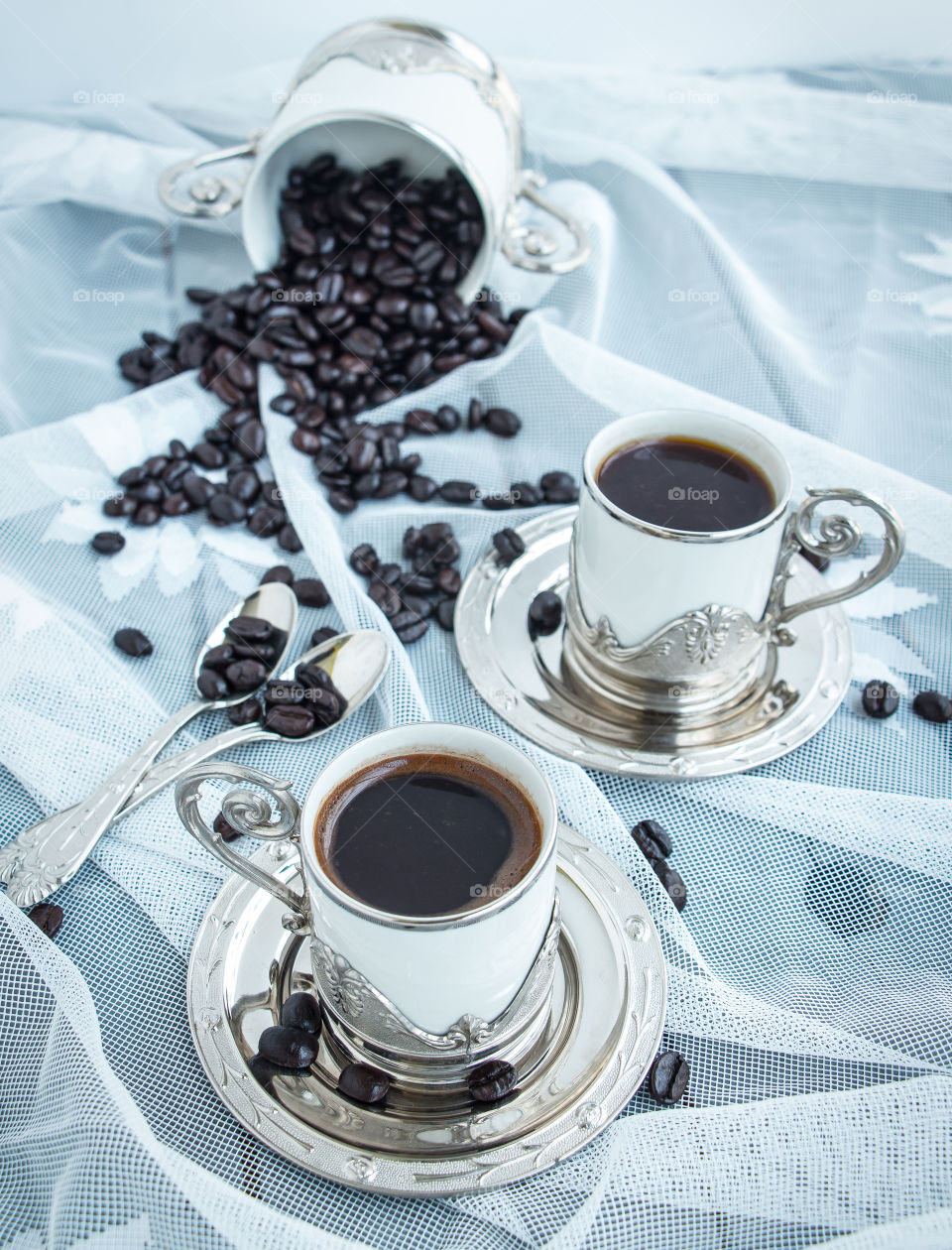 Coffee in silver silver decorated cups.