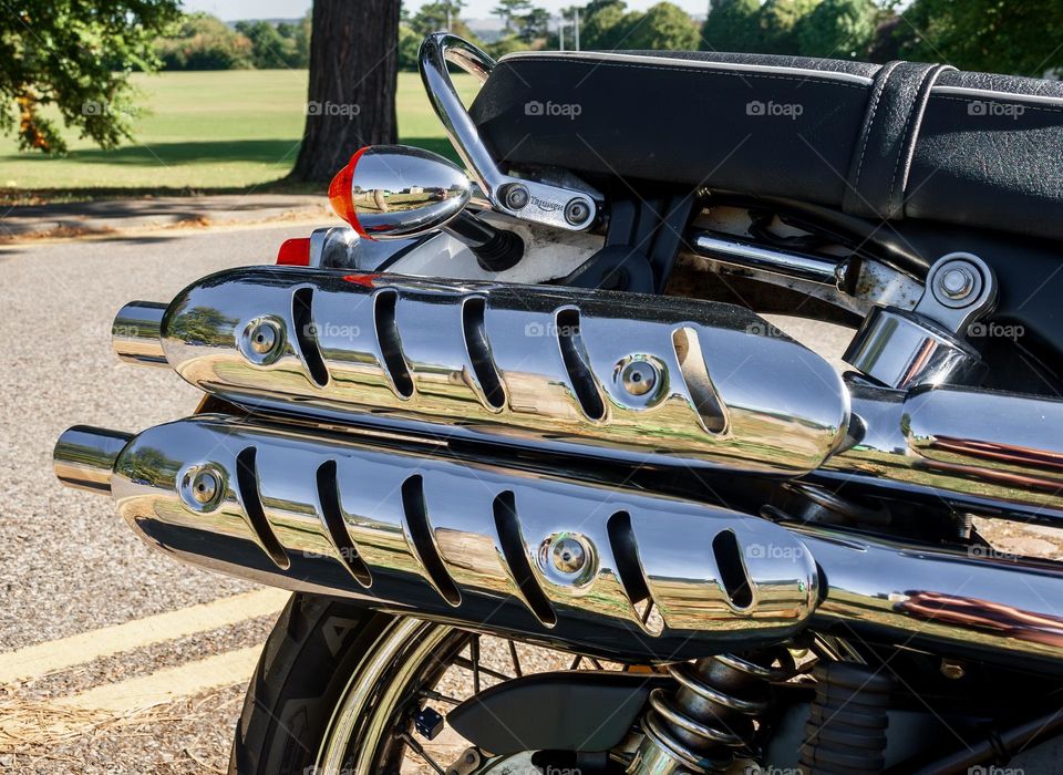 Shiny metal exhaust of a motorbike