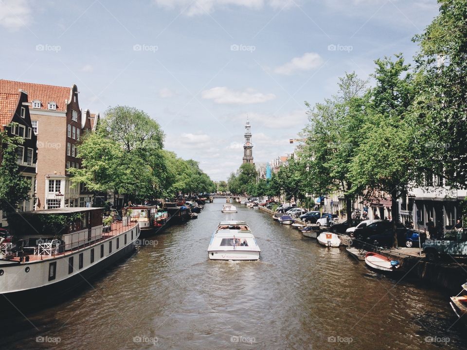 Amsterdam canal. One of the many canals in Amsterdam. On the background the "westerkerk" near the Anne Frank house
