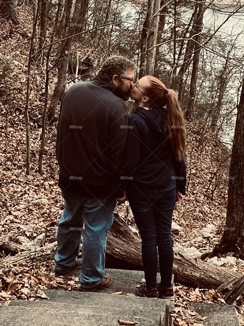 A kiss while walking through the Kentucky woods in the USA