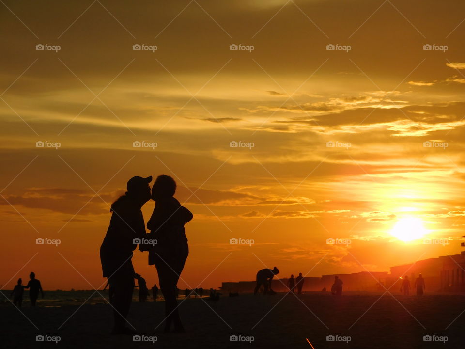 Mother and Daughter walking on the beach