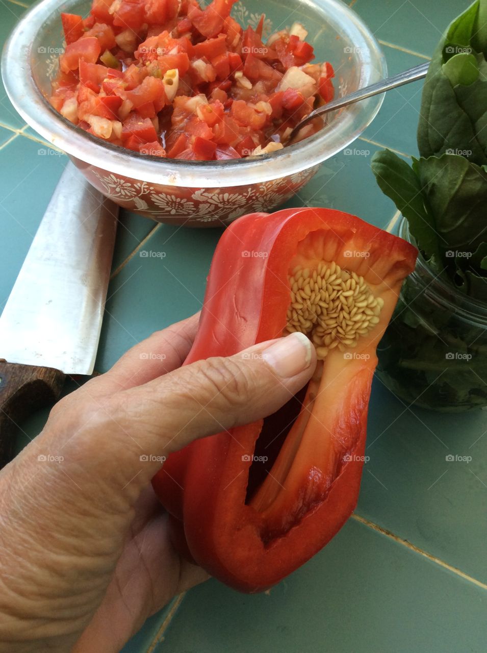 Cut red pepper showing seeds 