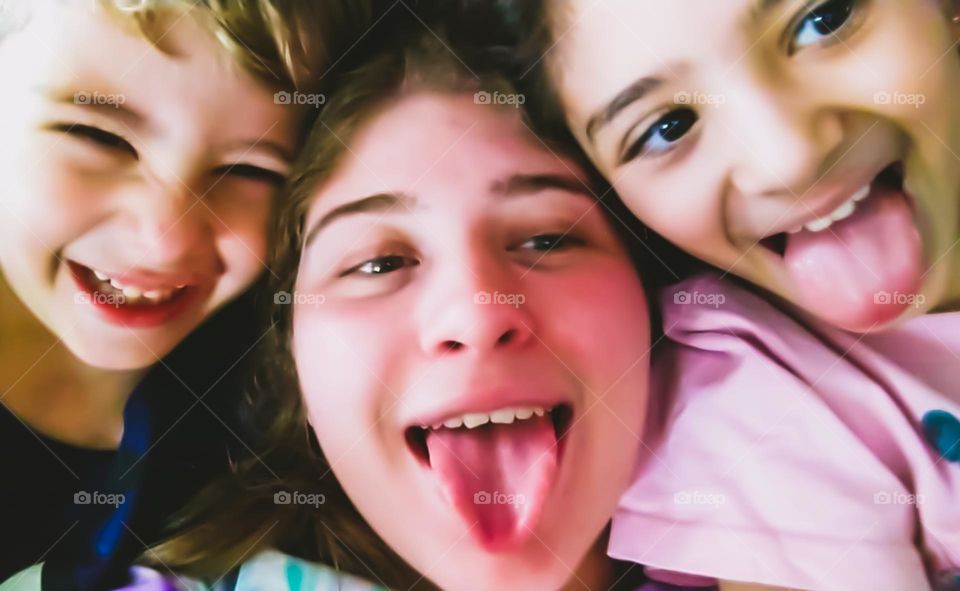 Selfie: kids making funny faces