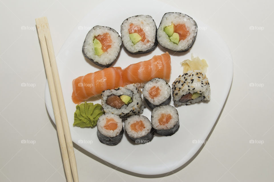 Delicious sushi set in white plate