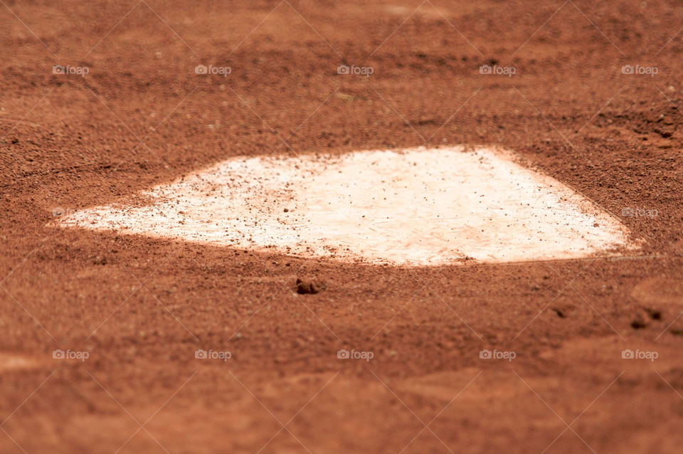 Close up of a baseball home plate.