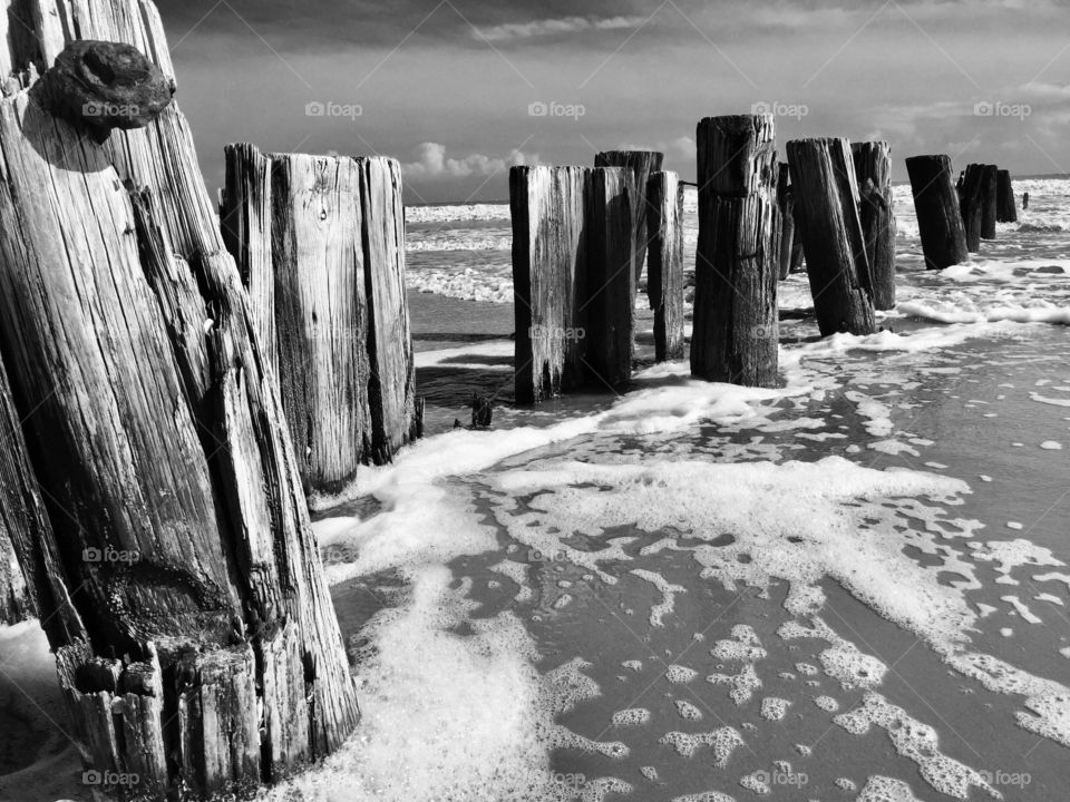 Black and White Photo of Foam and Tide on Folly Beach in South Carolina