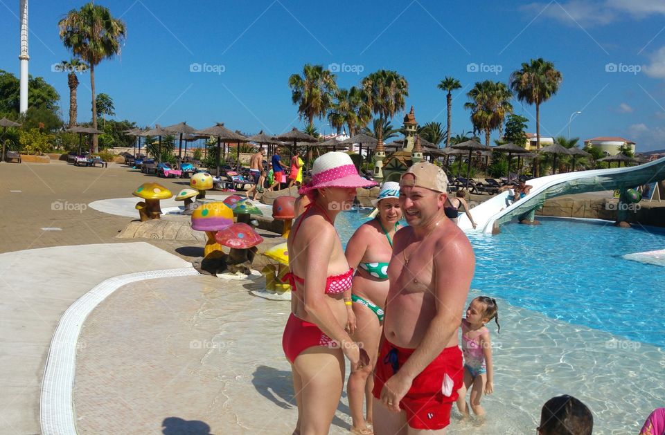 Family enjoying vacation at water park