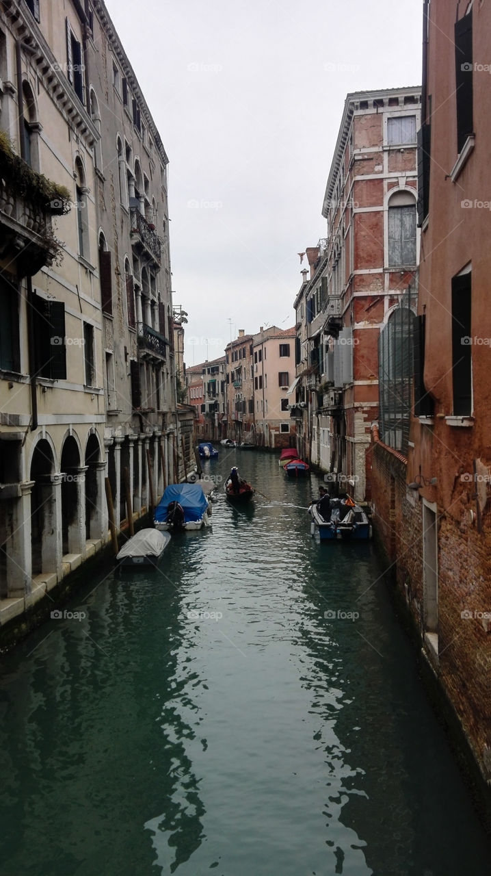 Gondolier on canal, Venice