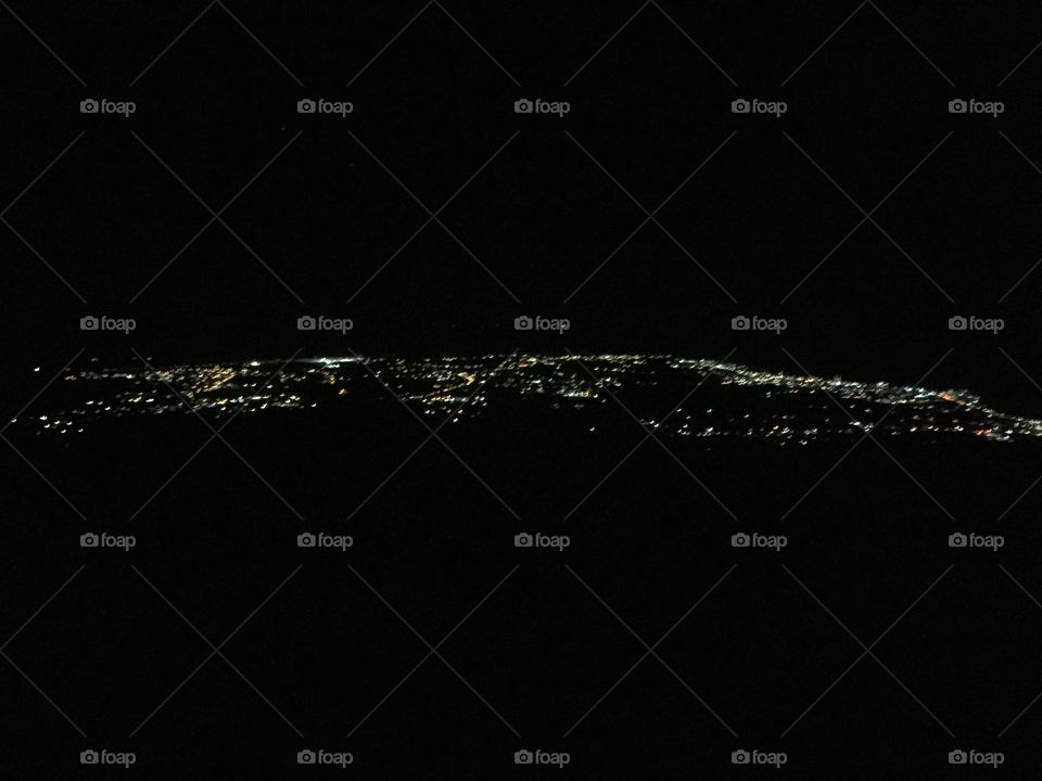 Lights of a city on Saipan, this view is from the top of Mt. Tapachau 