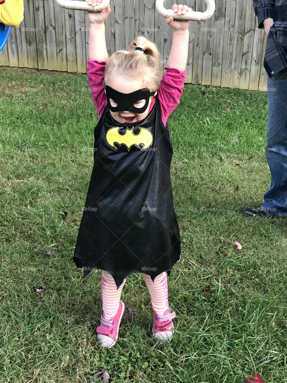 Toddler girl dressed as Batgirl for Halloween 