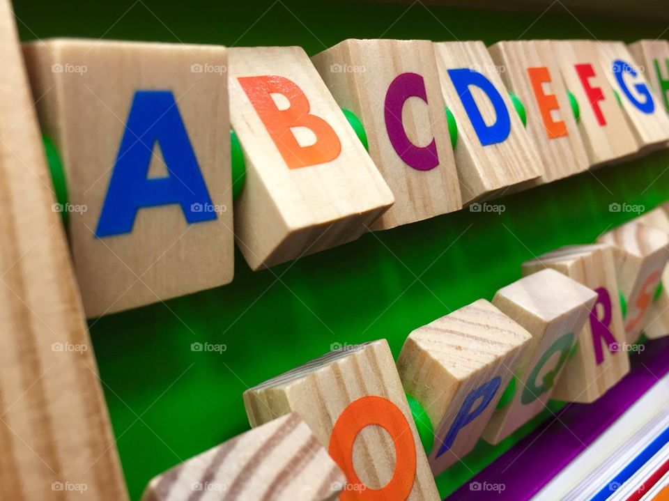 Alphabet from colorful wooden cubes