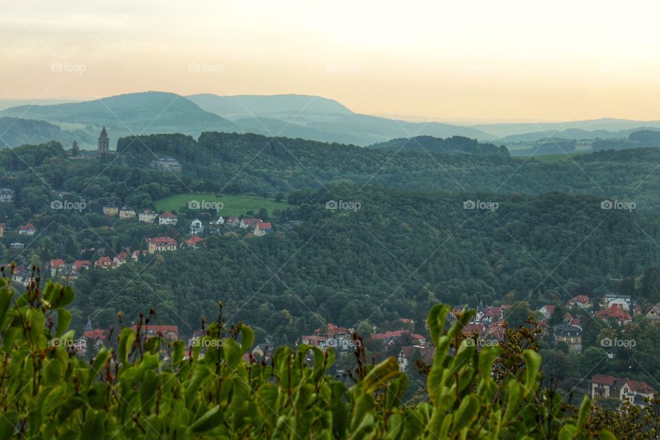 evening landscape. view of a small German village and mountain ranges and hills in the distance