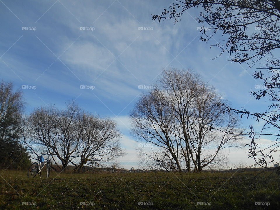 bike on a nature beautiful landscape blue sky background, autumn time