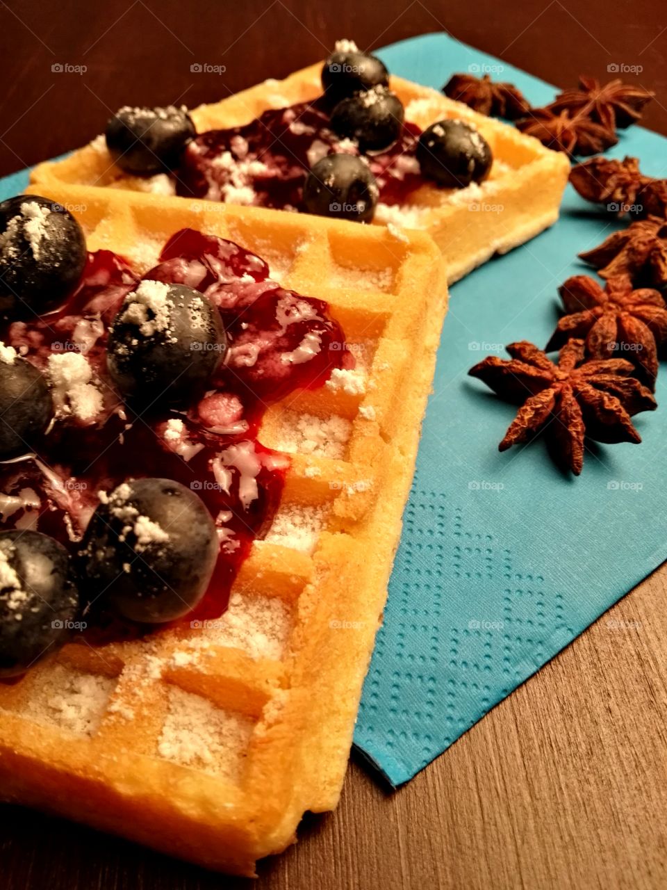 Healthy Christmas sweets with fruits, jam and dark chocolate on a rustic background