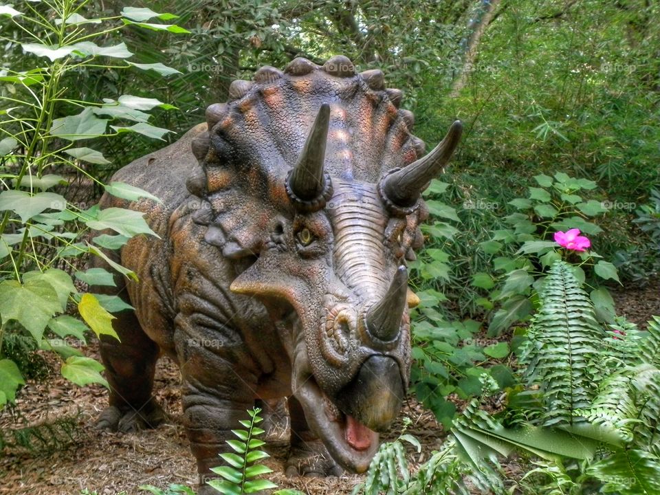Dinosaur in the woods at the zoo