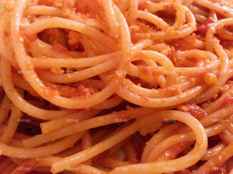 italian spaghetti with red tomato sauce and parmigiano cheese