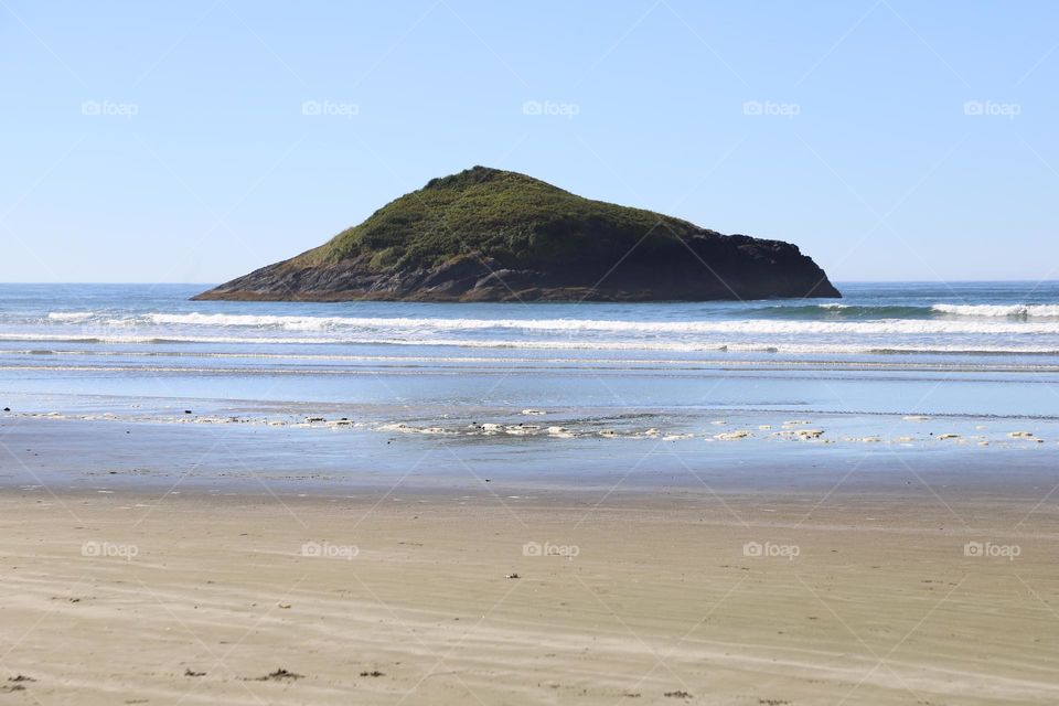 big rocky formation in the ocean 